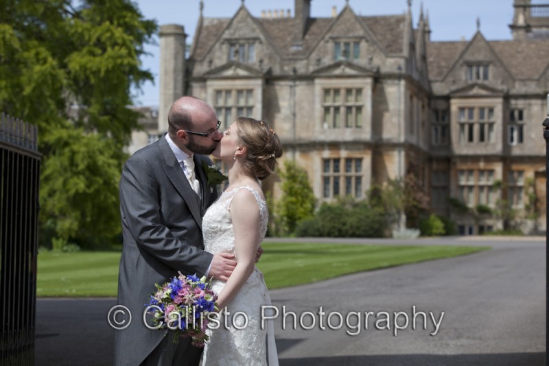 couple kiss by manor house