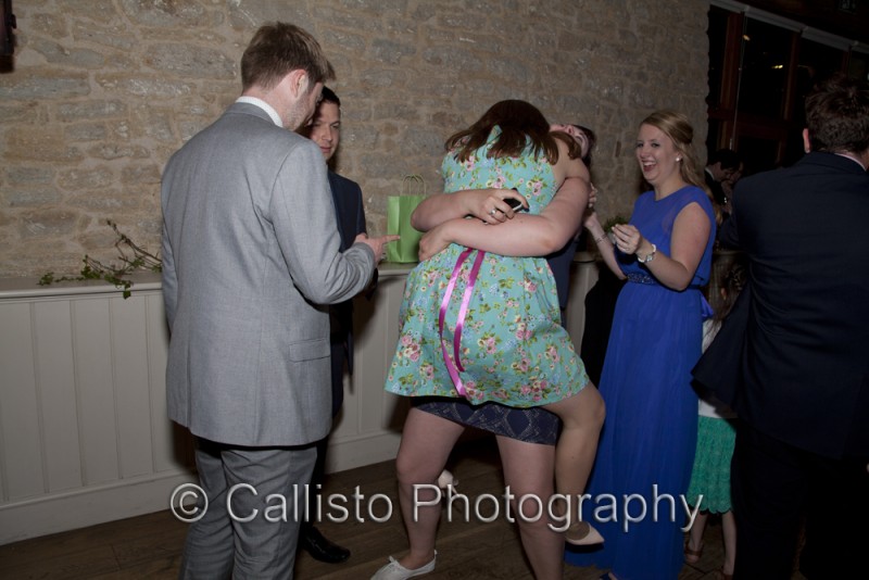 hugging wedding guests