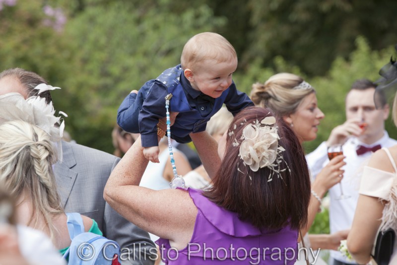 wedding guest playing with baby