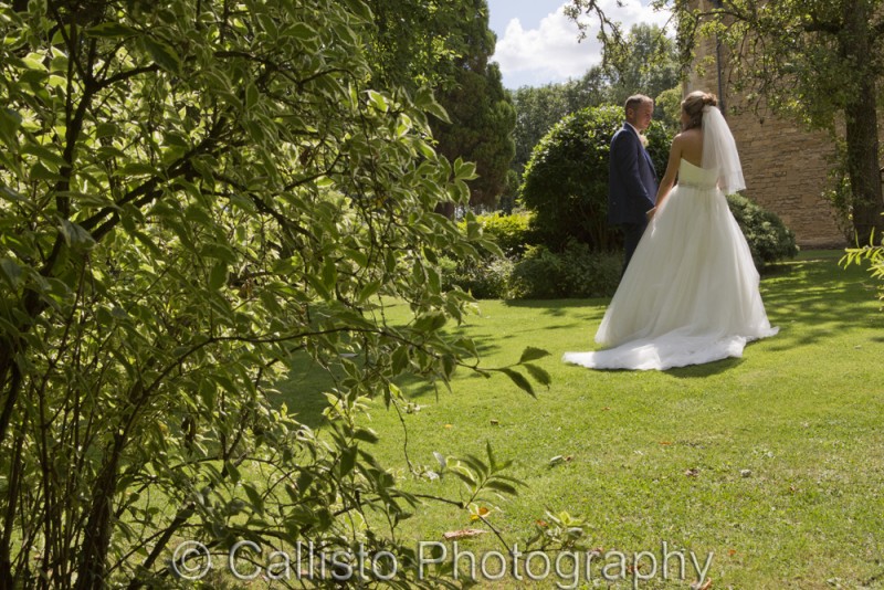 bride and groom chat in garden