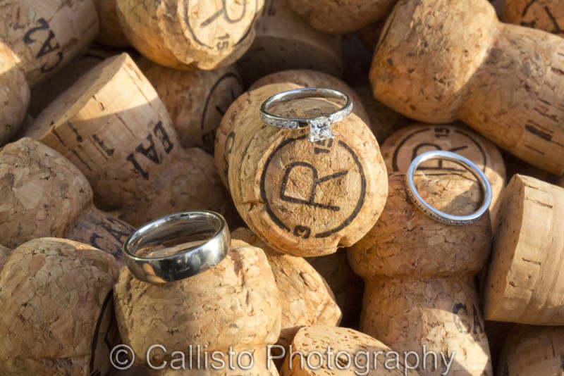 wedding bands on champagne corks