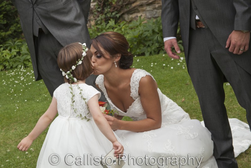 bride kissing bridesmaid