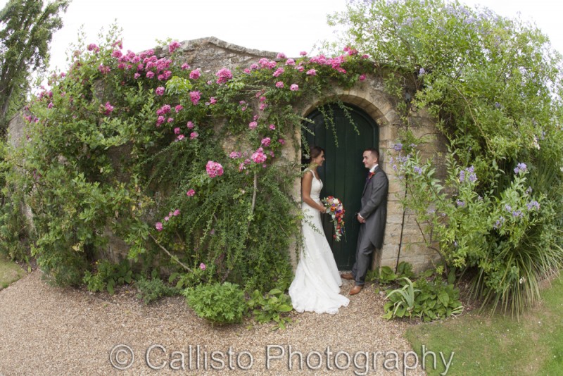 bride and groom in gate
