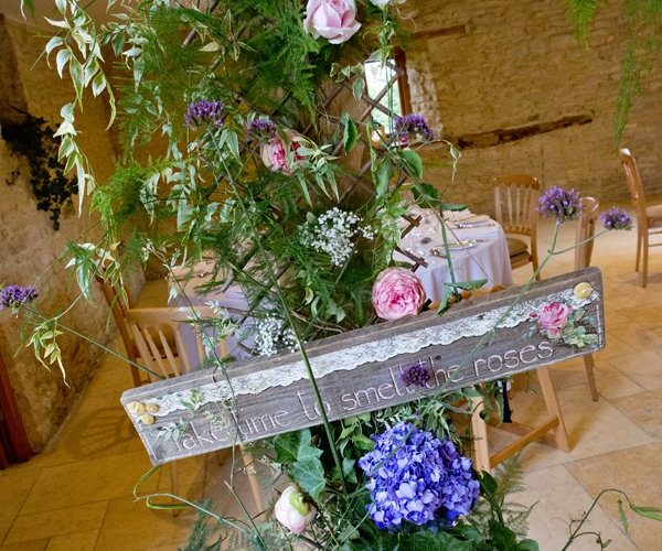 Kingscote Barn Wedding Photographers – Themed Flower Displays